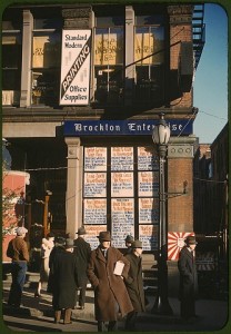 Headlines posted in street-corner window of newspaper office (Brockton Enterprise). Brockton, Massachusetts, December 1940. Reproduction from color slide. Photo by Jack Delano. Prints and Photographs Division, Library of Congress